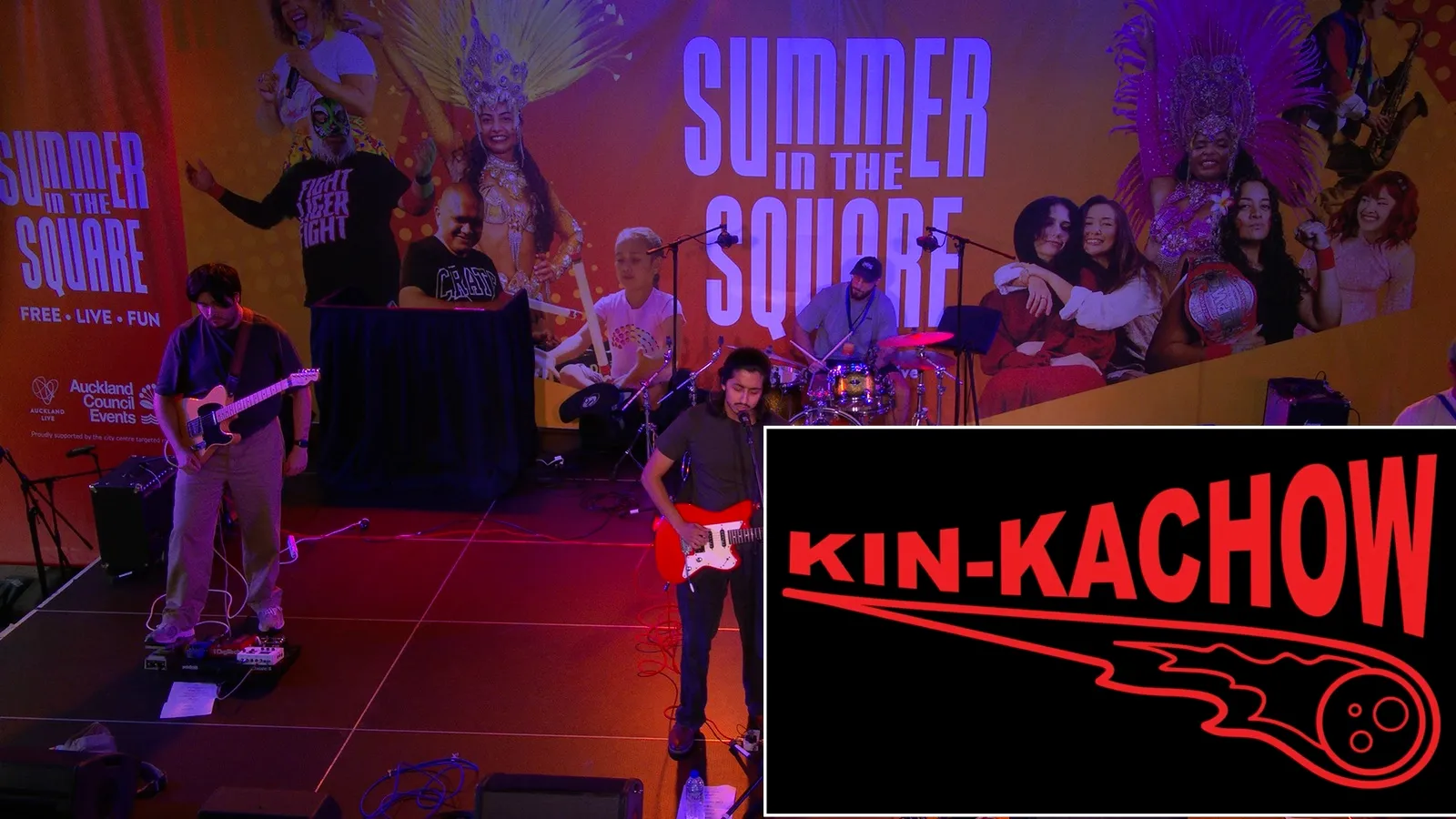 Kin-Kachow on stage, their name card on the broadcast frame